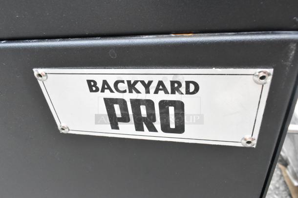 Backyard Pro 554SMOKR60AS 60" smoker grill, brand new, scratch and dent condition, label plate visible.