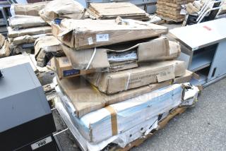 Damaged boxes of Backyard Pro items, including a stainless steel table, utility cart, and equipment stand. Model 554SMOKR60AS.