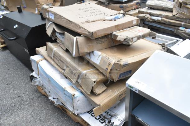8 new scratch and dent items, including Backyard Pro 554SMOKR60AS, stainless steel tables, utility cart, and equipment stand in damaged boxes.