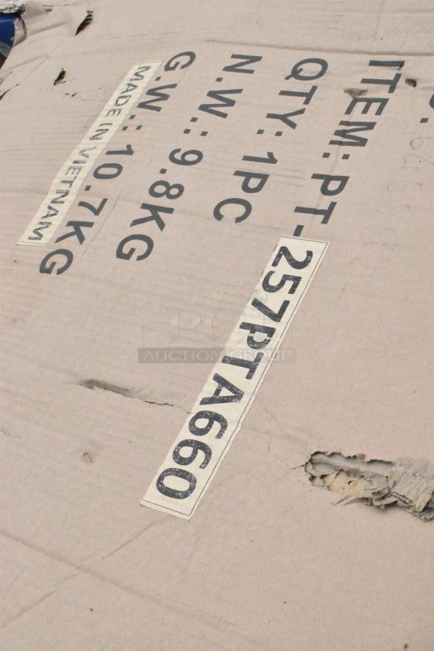 Cardboard packaging with visible text: "ITEM: PT-257PTA660," "QTY: 1 PC," "N.W.: 9.8 KG," "G.W.: 10.7 KG," "Made in Vietnam," showing signs of wear.