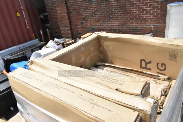Cardboard boxes containing 14 new scratch and dent items, including solid shelves and bi-fold tables, packed on a pallet.