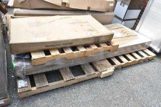 2 new scratch and dent items on pallet: 164DYMU Lancaster table dolly, 600TSB3096S Regency stainless steel work table in original packaging.