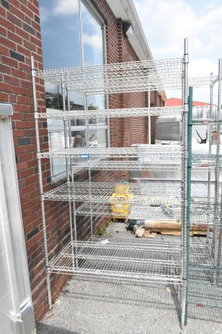 Chrome finish 5-tier wire shelving unit, in good condition. Buyer must dismantle for shipping. Consider freight charges.