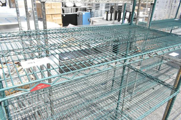 Metro green 4-tier wire shelving unit, sturdy construction, dismantling required, metal frame, suitable for storage.