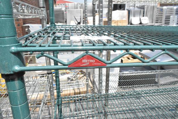 Metro 4-tier wire shelving unit in green finish, with antimicrobial label. Dismantling required by buyer. Consider freight.