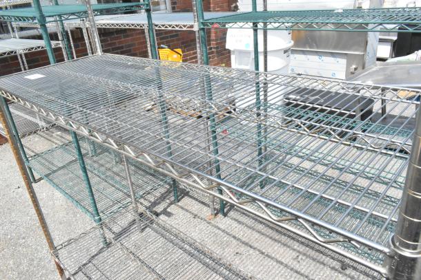 Metro chrome finish 3-tier wire shelving unit in outdoor condition, buyer must dismantle. Freight charges apply.