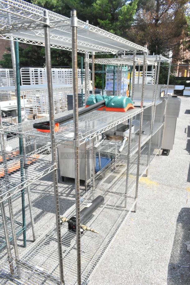 Metro chrome 3-tier wire shelving unit, includes 2 snow shovels and water filter. Buyer must dismantle; consider freight charges.