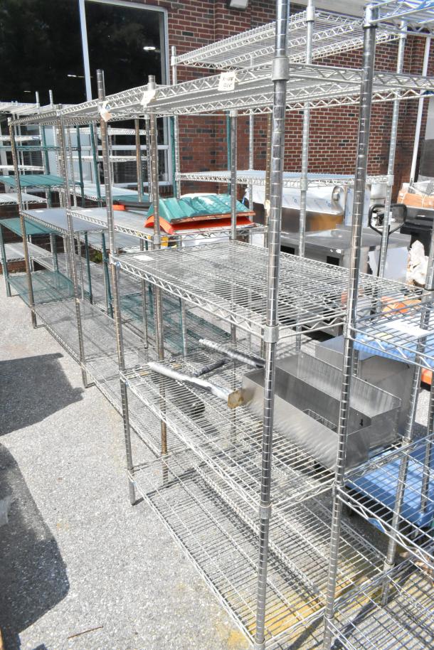 Metro chrome 4-tier wire shelving unit with contents including stainless steel speedwells. Buyer must dismantle.