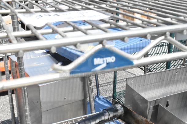 Metro chrome 4-tier wire shelving unit with stainless steel speedwells, requires buyer dismantling for shipping.