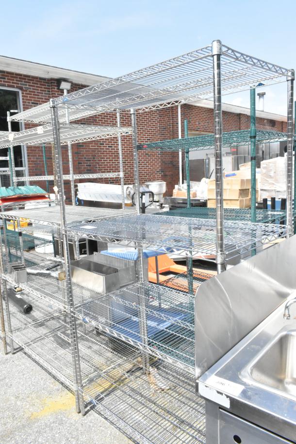 Metro chrome 4-tier wire shelving unit; durable and spacious. Buyer must dismantle; freight charges apply.