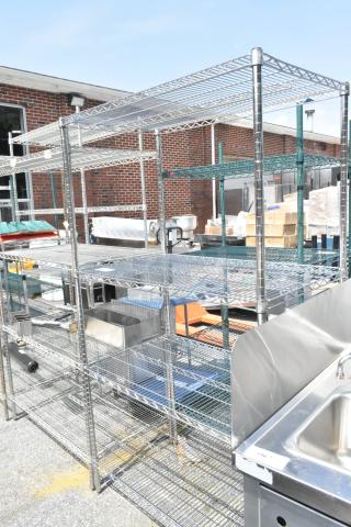 Metro chrome 4-tier wire shelving unit; durable and spacious. Buyer must dismantle; freight charges apply.