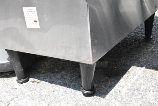 Bunn ICDD-3 stainless steel dispenser, slightly worn, visible label, durable design on sturdy legs.