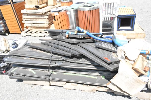 Lot of parts for poly cabinet, including black panels and blue hoses, on a pallet. Mixed condition. Ideal for assembly or repair.