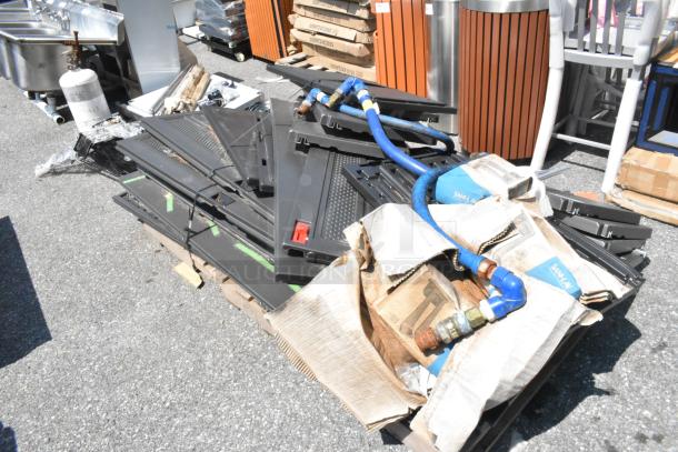 Lot of Poly Cabinet pieces on pallet, includes black panels, blue hoses, and packaging material. Some wear visible.