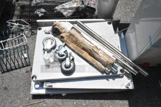 BRAND NEW Regency 600TSB3036S 30" x 36" work table, 16-gauge stainless steel, with 4" backsplash, undershelf, and casters.