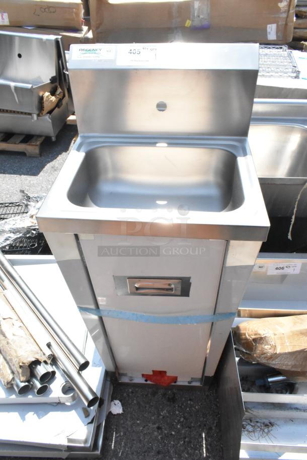 Brand new Regency 600HS17FTPD hands-free hand sink with pedestal. Scratch and dent condition. Brand label visible.