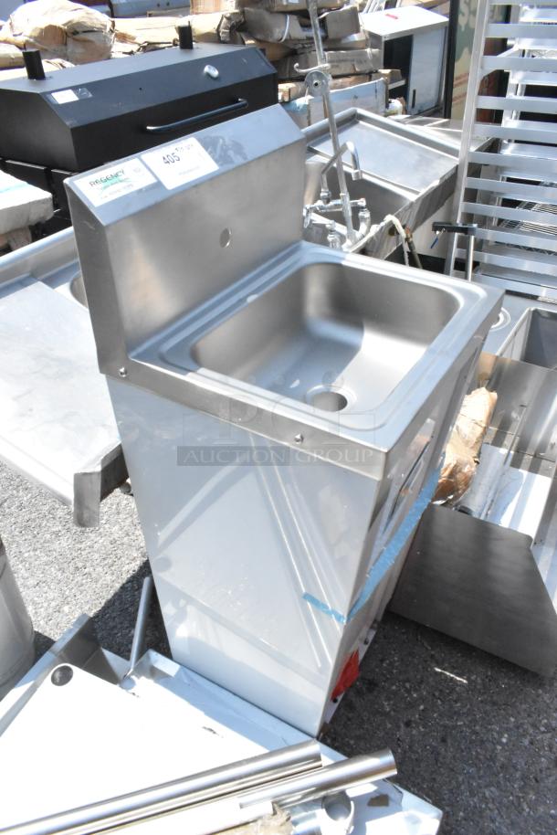Brand new Regency 600HS17FTPD hands-free hand sink with pedestal base, minor scratches, stainless steel construction.