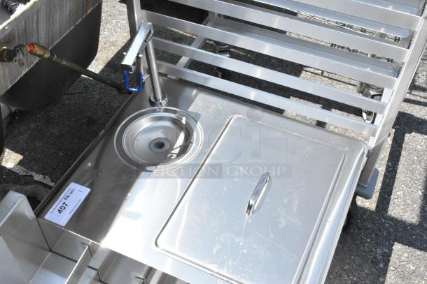 Stainless steel drop-in ice bin and water dispenser, brand new with minor scratches and dents, includes utility tag.