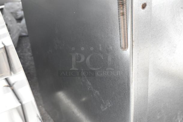 Brand new stainless steel drop-in ice bin with water dispenser, visible surface scratches, ideal for commercial use.