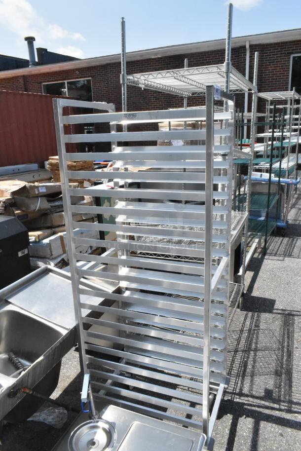 Brand new New Age metal pan transport rack with commercial casters; scratch and dent condition.