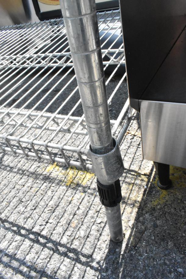 Chrome finish 4-tier wire shelving unit with adjustable poles. Buyer must dismantle. Consider freight charges.