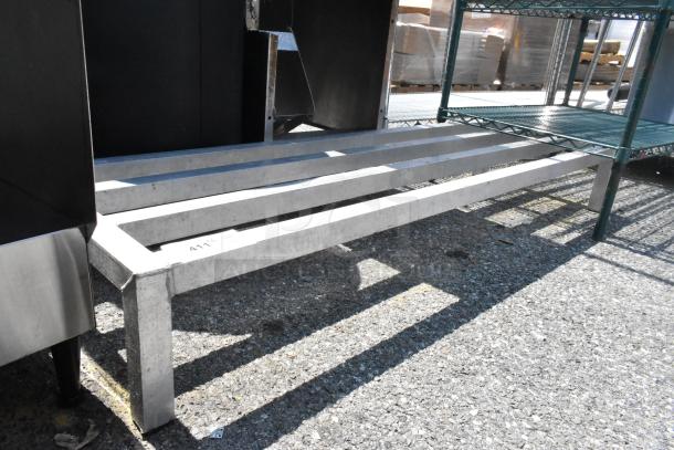 Metal Dunnage Rack with sturdy construction, three slats, and light surface wear. Ideal for storage support.