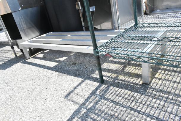 Metal Dunnage Rack, sturdy silver finish, elevated design for storage efficiency, excellent condition, ideal for kitchens.