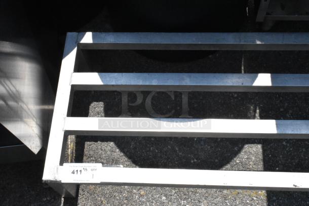 Metal Dunnage Rack with sturdy construction, designed for storage efficiency. Label indicates "411 ⅛ QTY 1," enhancing value.