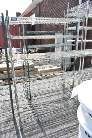Chrome finish 5-tier wire shelving unit in good condition. Buyer must dismantle for shipping. Freight charges apply.