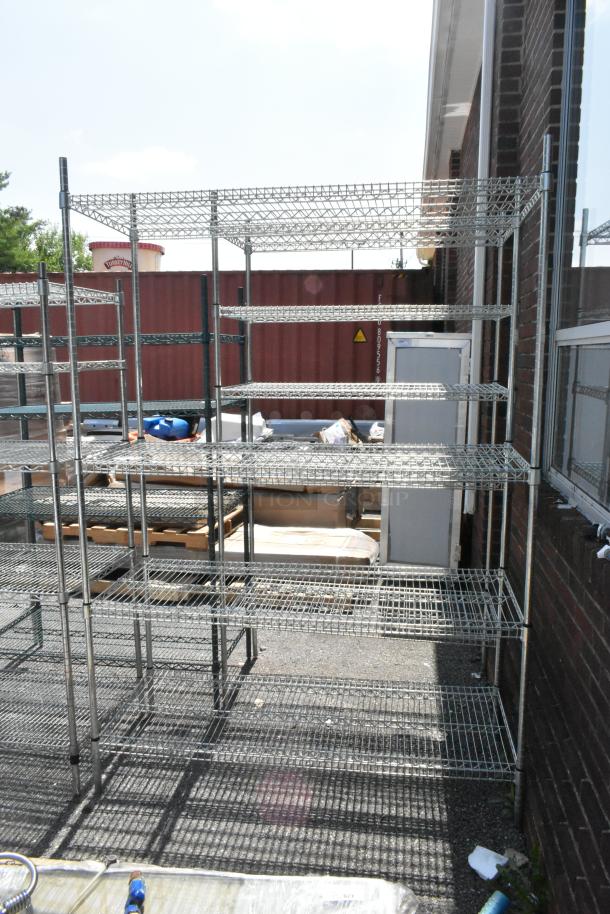 Chrome finish 4-tier wire shelving unit. Outdoor setting. Buyer must dismantle. Consider freight charges.