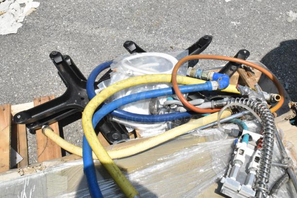 Pallet lot with gas hoses, spray nozzle, and a 460EG2448 Regency 24"x48" NSF green epoxy wire shelf in used condition.
