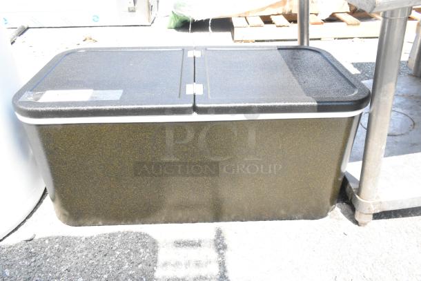 Brand new scratch and dent bin with center hinge lid, black with speckled finish, slight surface imperfections.