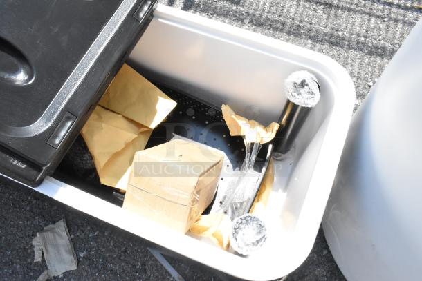 Brand new bin with center hinge lid, showing minor scratches. Includes interior packaging materials. Ideal for storage.
