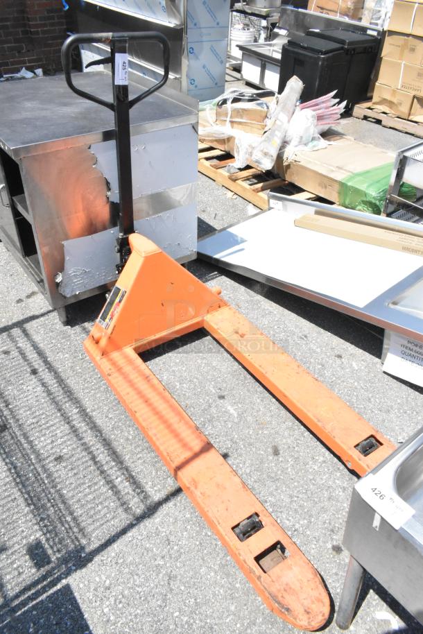 HaulMaster 2.5 Ton Pallet Jack, orange metal, 5,000 lb capacity, visible wear, black handle, marked with load capacity label.