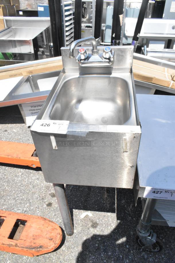 Stainless steel single bay sink with faucet and handles, durable condition, auction tag indicating item number 426.