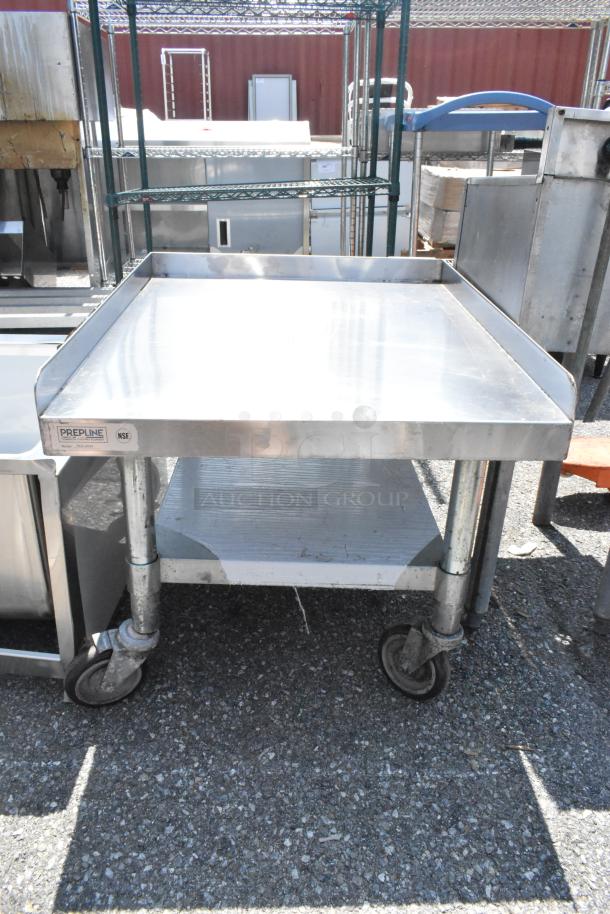 PrepLine PES-3024 stainless steel equipment stand, metal under shelf, on commercial casters, with visible NSF label.