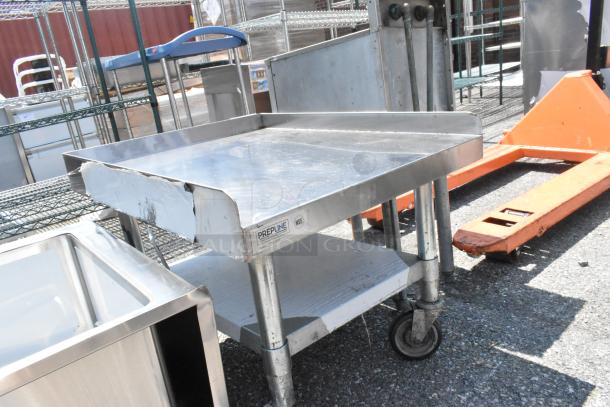 PrepLine PES-3024 stainless steel equipment stand with metal under shelf and commercial casters, visible label. Minor wear.