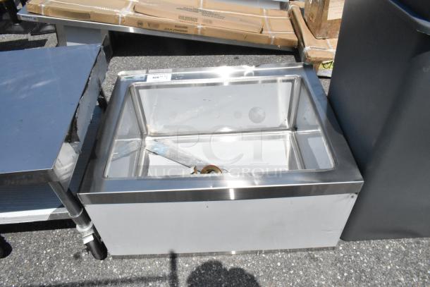 Brand new Regency 600SM202812 mop sink, 33" stainless steel, 16-gauge, one compartment. Size: 28"x20"x12". Some dents visible.