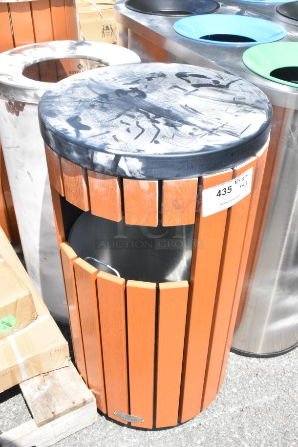 Brand new Lancaster Table & Seating trash can shell with wood pattern. Some scratches visible. Label marked "435."