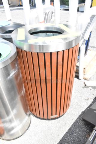 Lancaster Table & Seating trash can shell, metal top, wood pattern sides, new with visible scratches and dents.