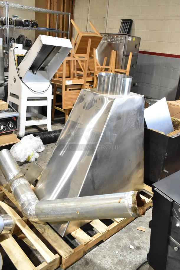 US Roaster Corp commercial coffee bean roaster, metal, natural gas powered, 23 kilo capacity, shown in warehouse setting.