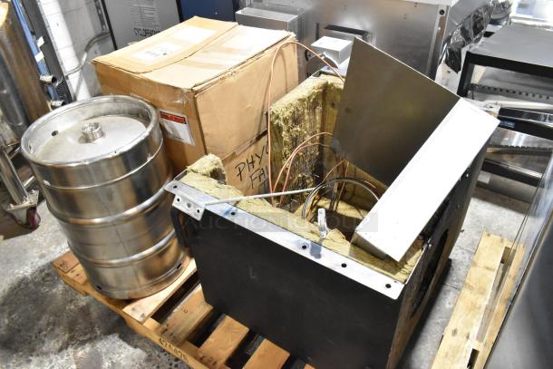 US Roaster Corp commercial coffee roaster, 23 kilo, natural gas, metal, 208-230/460V, 3 phase, on pallet with metal drum.
