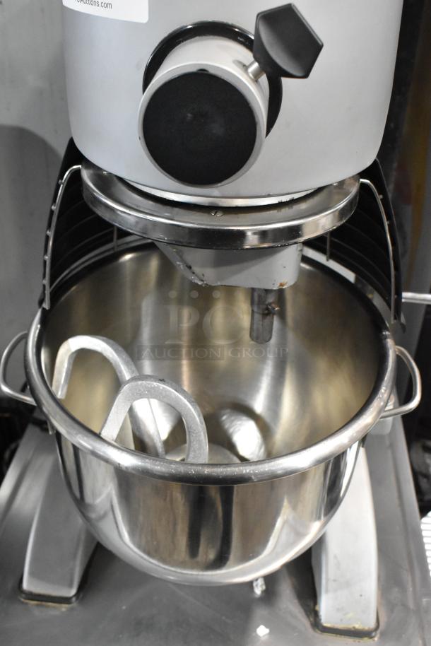 Berkel FMS20 commercial 20-quart dough mixer with stainless steel bowl, bowl guard, dough hook, on equipment stand with casters.