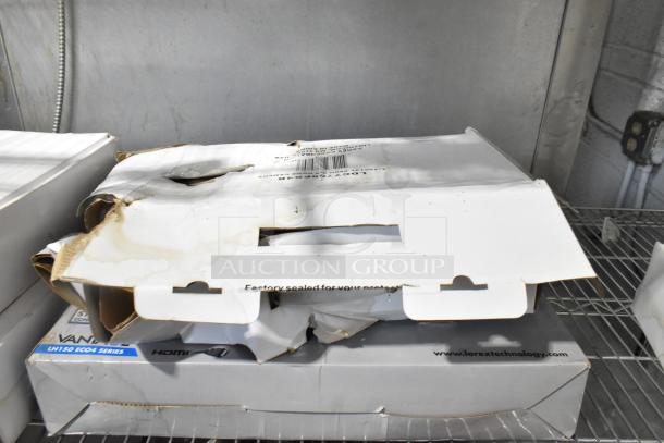 Lot of Lorex surveillance equipment, damaged packaging. Includes digital recorder, CVC7711PK4B, MC7711 AIS, LDC7708PK4B cameras.