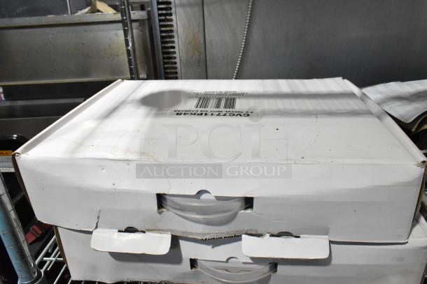 Lot of Lorex surveillance equipment in boxes, includes digital recorder and dome cameras, model numbers visible on labels.