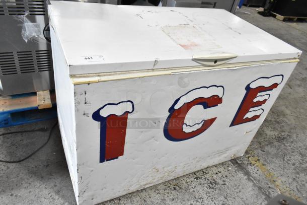 Frigidaire GLFC1526FW5 metal chest freezer, 115V, 1 phase, worn exterior with “ICE” lettering, auction tag visible.