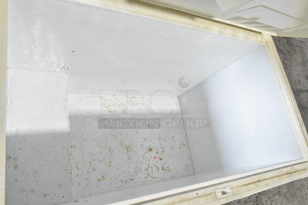 Frigidaire GLFC1526FW5 chest freezer, metal, 115V, 1 phase. Interior shows wear with scratches. Model label visible.