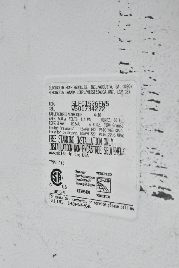 Label on Frigidaire GLFC1526FW5 chest freezer, detailing model, 115V, refrigerant type, and installation info.