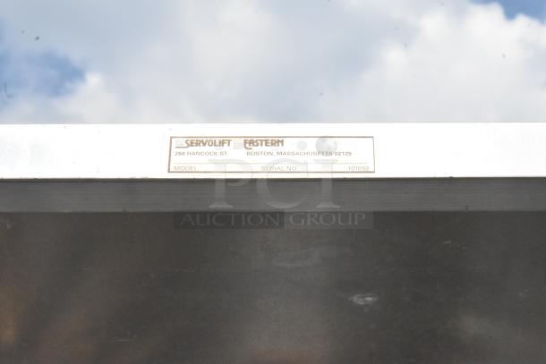 Servolift Eastern #10 Can Rack, serial number 101092, featuring a sturdy metal construction, ideal for industrial use.