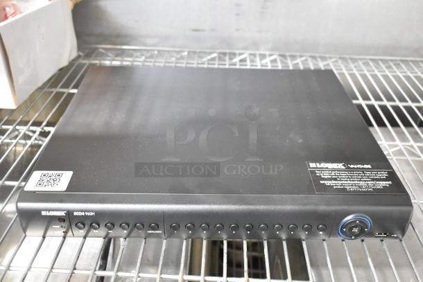Lorex digital video surveillance recorder ECO4 960H on a shelf, featuring multiple input ports, with branding and label visible.